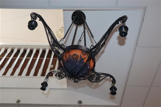 A Daum glass and cast iron four branch ceiling light, 49cm wide